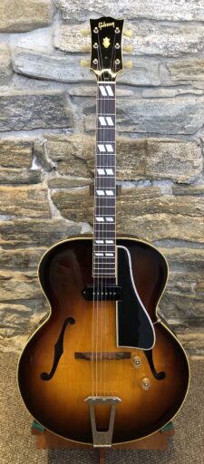 Front view of the 1950 Gibson ES-300 showcasing its sunburst finish, single P-90 pickup, and classic archtop design.