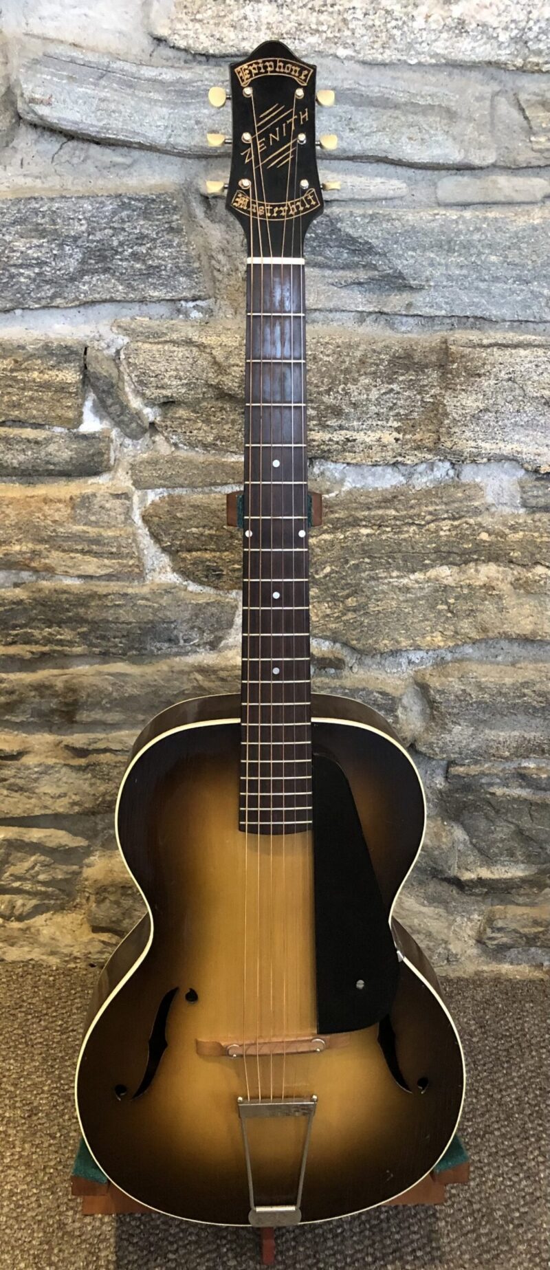A 1934 Epiphone Zenith archtop guitar with walnut back and sides, photographed on display at AcousticMusic.org